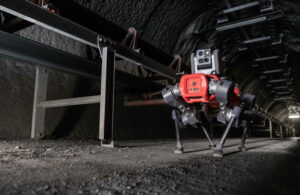 An ANYmal quadruped walking through a tunnel.