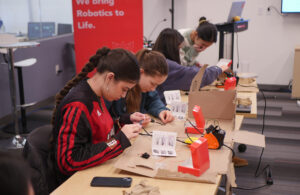 Four girls working on projects as part of the jumpstart fellowship program.