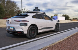 A Waymo vehicle on a freeway.